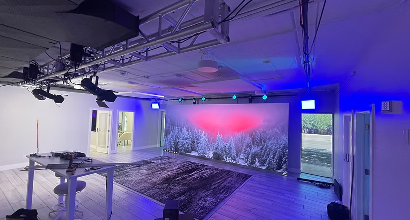 Completed TTP Studio with overhead production lighting and a large video display